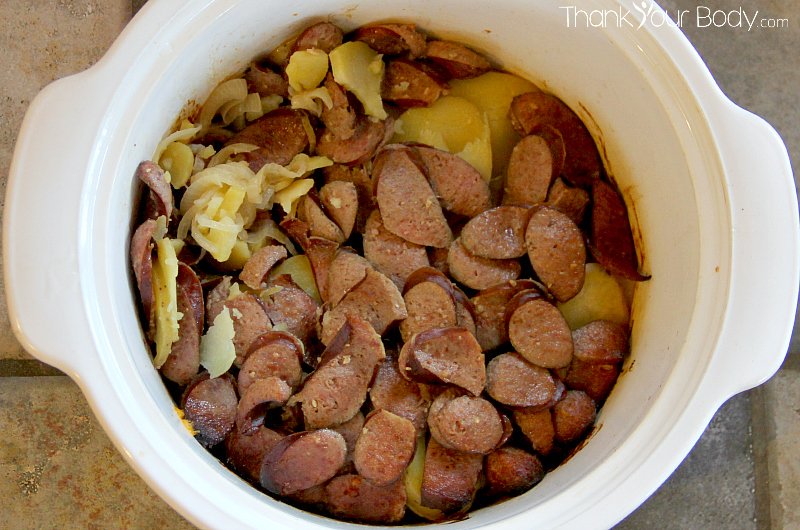 Yukon Gold potatoes, sweet onions and nitrate-free organic sausage, slow cooked and then mixed with homemade sauerkraut. Yum!